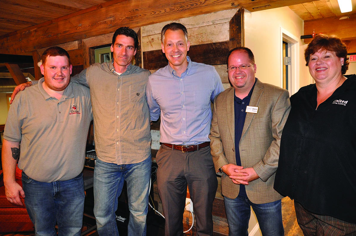 (l to r:) Dakota Lotz, Divine Stoneworks; Robert Marra, Marra Flooring; John Dudley, United Home Experts; Glenn M. Travis, GMT Home Designs and Tabitha Ruggles, Sixty Pleasant Realty LLC welcome open house guests to the new MetroWest Design Center.