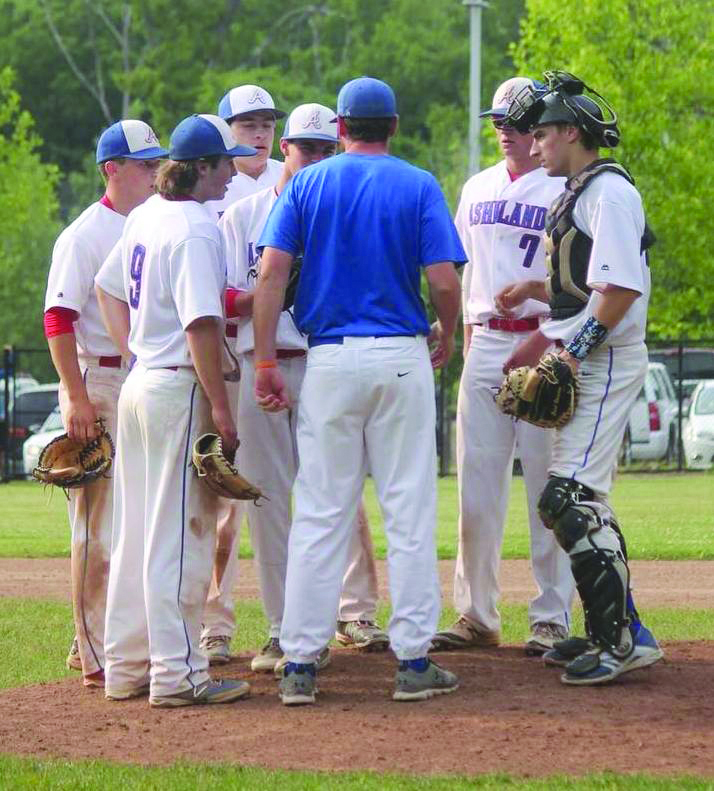 Two players that Ashland coach Matt Messer (back to camera) will be counting on are pitcher Luke Gustavson (7) and catcher Erich Vinacco, far right. Gustavson has a two-year earned run average of 2.29 and an 8-5 record for two campaigns. Vinacco is a top-notch defensive catcher who hit .346 last year. (Photo/supplied)