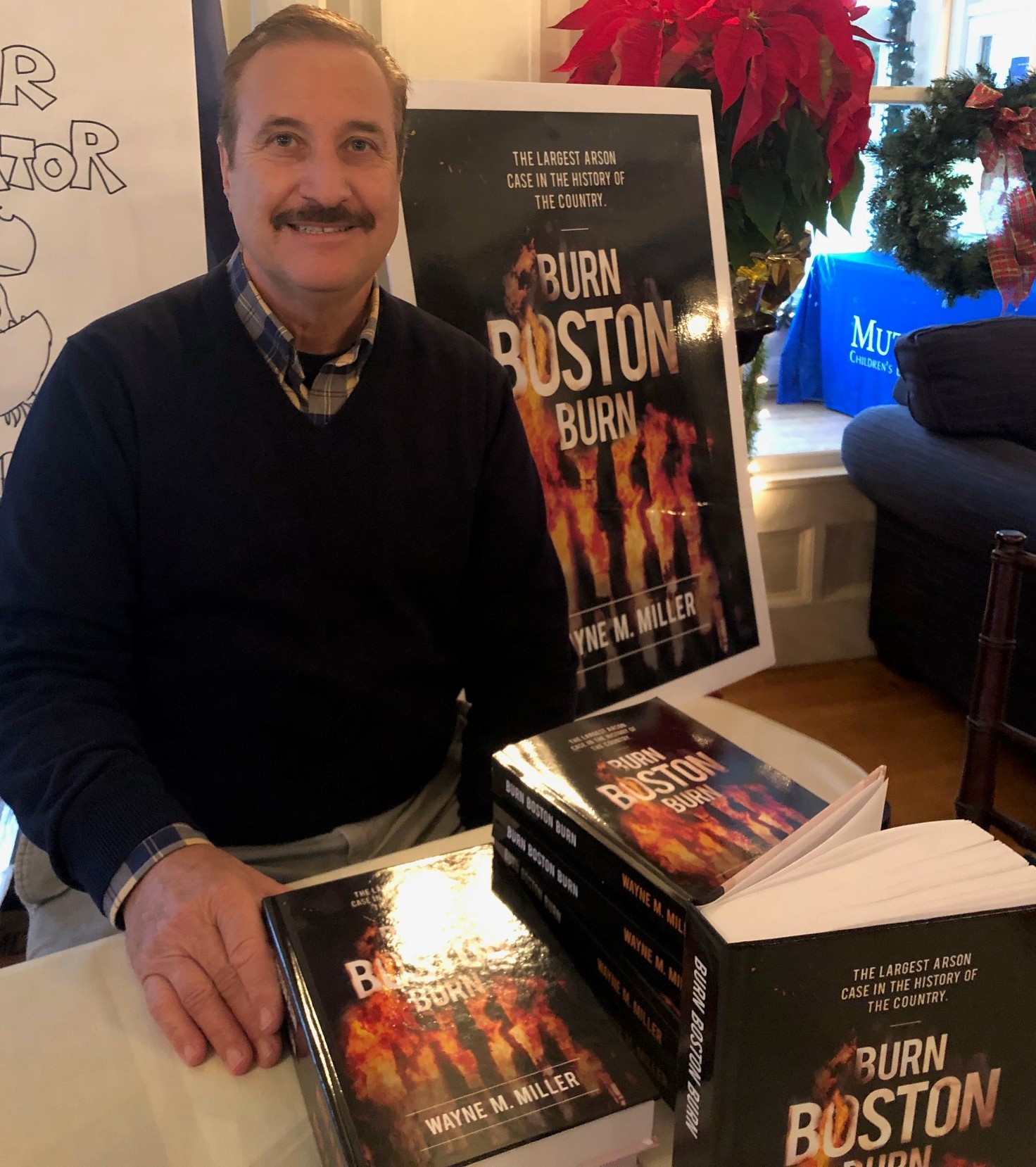 Franklin author Wayne M. Miller is shown here with his book, Burn Boston Burn, which details the story of arson in Boston in the early 1980s. Miller will speak at Franklin Public Library on February 8th and at Franklin Country Club February 27th.