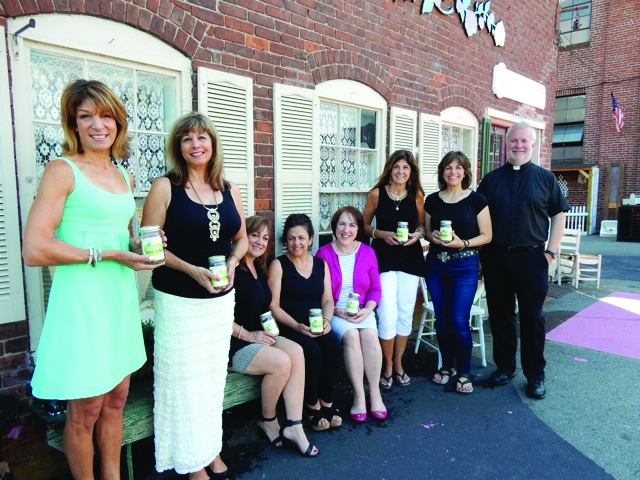 Developers of Sittee’s Savory Kitchen Middle Eastern salad dressing, the Ladies of St. George display their new product. From L to R: Dianne Elias Shalbey, Sharon Elias Weiskerger, Barbara Deeb Campbell, Joan Kelley Cassidy, Leeann Sacre Plouffe, Christine Pucci Byron, Erin Farha Kimmett, and the Very Reverend Josph Kimmett, pastor of St. George Orthodox Church. Missing from the photo: Jenna Weiskerger.