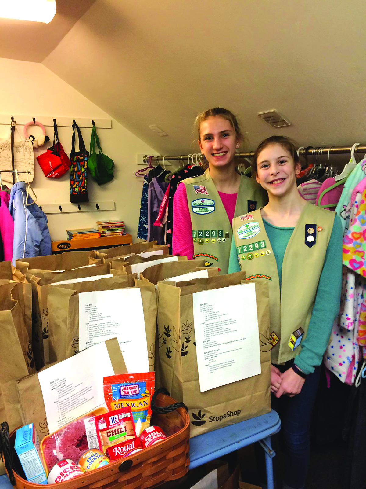 Emily Arthur and Mary Dougherty of Natick Cadette Girl Scouts Troop 72293 at “A Place to Turn” food pantry in Natick.  