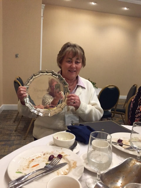 Emily Nicodemus with silver tray awarded to Garden Club of Norfolk for its outstanding newsletter.