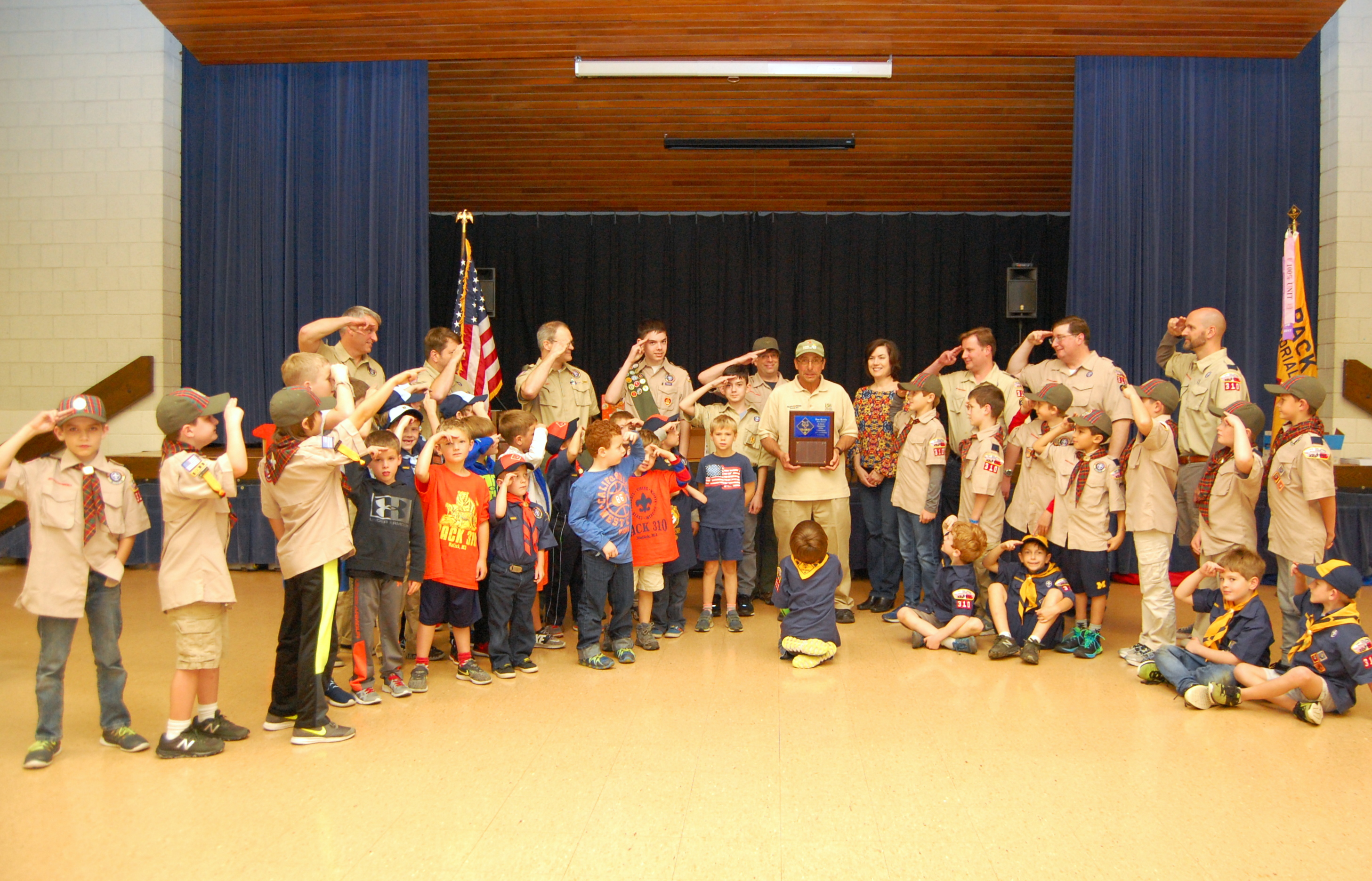 Natick Cub Scouts honor Fran Morello with a salute.