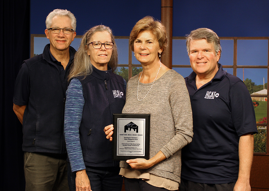 Shown is HCAT members with the national Hometown Media Award it received in the news magazine show category for “Heartbeat of Holliston.” From left, Bruce Gilfoy, Lisa Hedrick, Chryso Lawless, and Don Cronin.