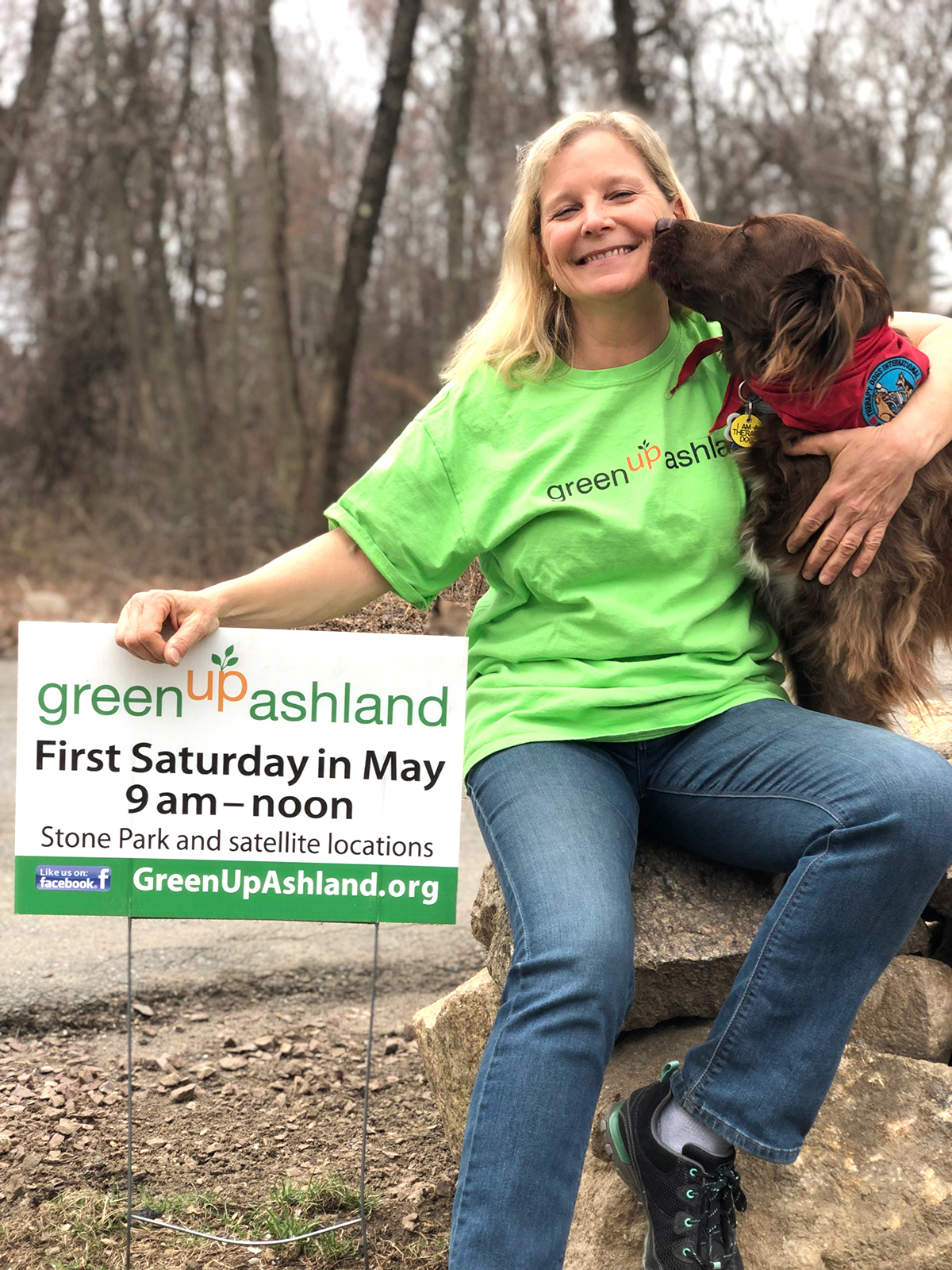 Janet Gamache poses with her service dog, Lydia, and a GreenUp Ashland sign. (Photo/supplied)