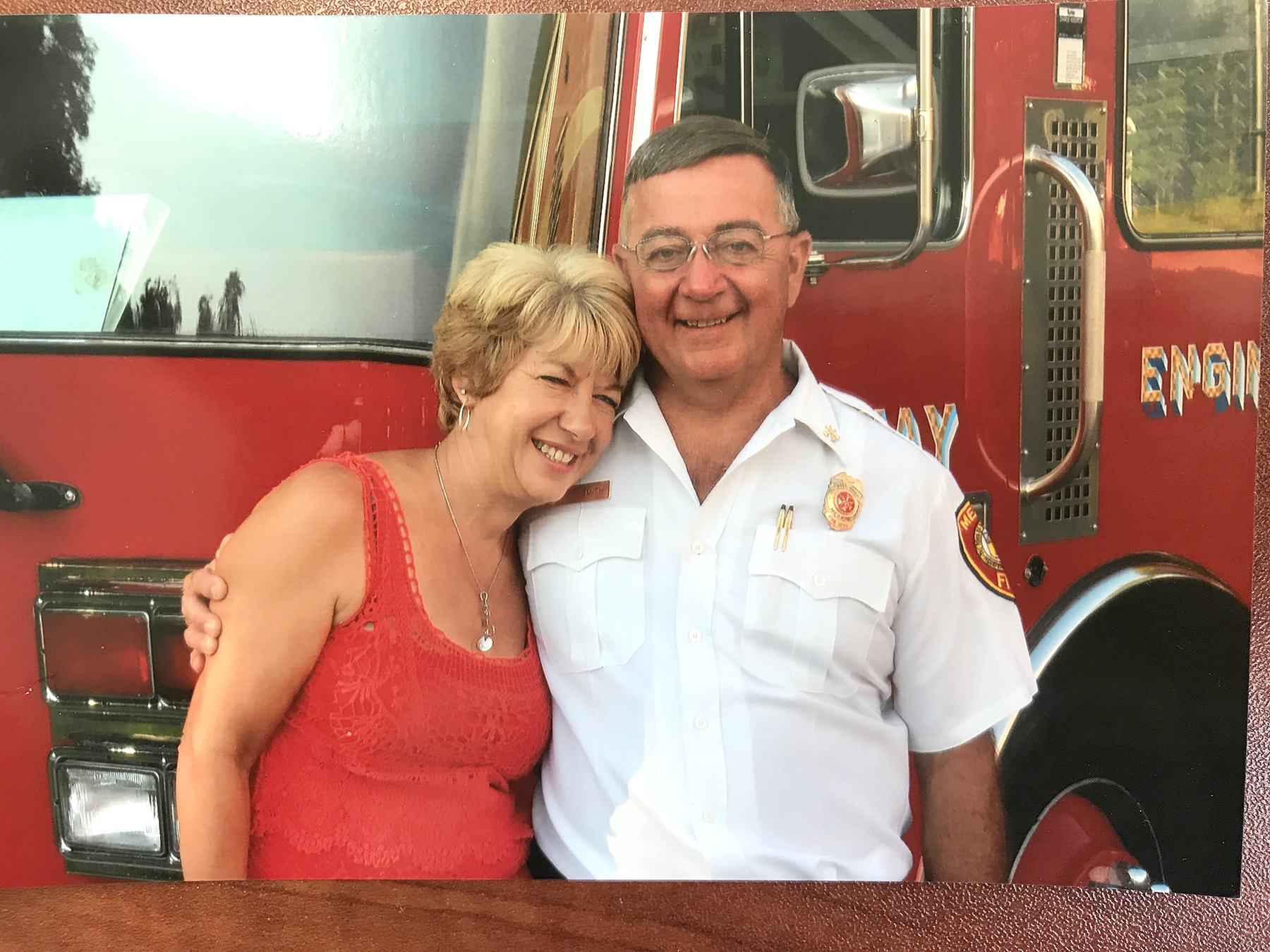 Shown right is the metal cast of the clock that will stand at the newly revamped Choate Park in Medway. The clock was donated by Jim Smith to the town in memory of his fiancée, Cindy Kairit Reding (shown together above), who grew up across the street from where the clock will stand. The finished piece, painted blue with the plaque shown, will be unveiled at the park’s opening later this fall. Clock photos courtesy of the Electric Time Company, Inc., of Medfield. Personal photo courtesy of Jim Smith