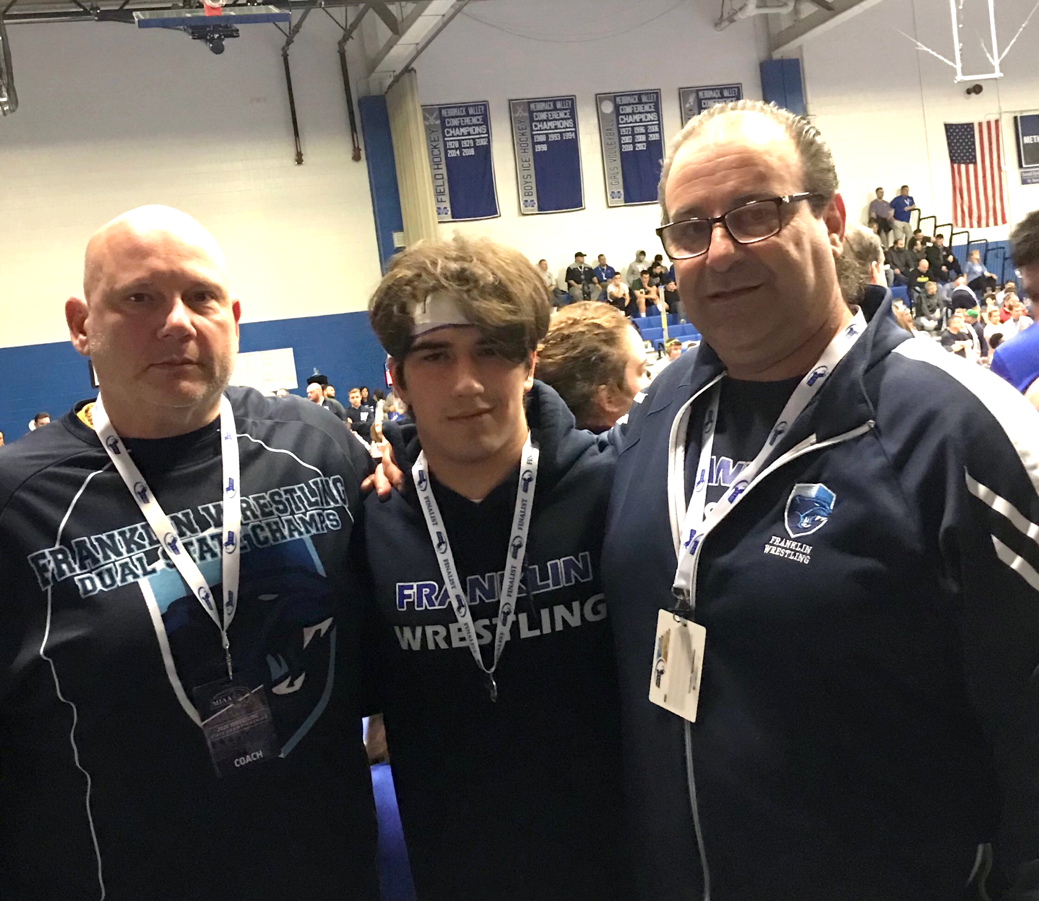 This year, the Franklin High Wrestling team had hoped to win the Hockomock League, win the Sectionals and finish in the top five in the state. They achieved all of those goals. Shown, from left to right: Asst. Coach Scott Blake, Dom Sackley, and Coach Carmine Carlucci. Photo courtesy of Coach Carlucci