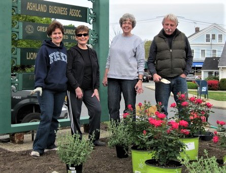 Chris Hall, Gretchen Bravacos, Lois Bennett and David Foster (l to r) plant the downtown clock garden. (Photo/Ashland Garden Club)