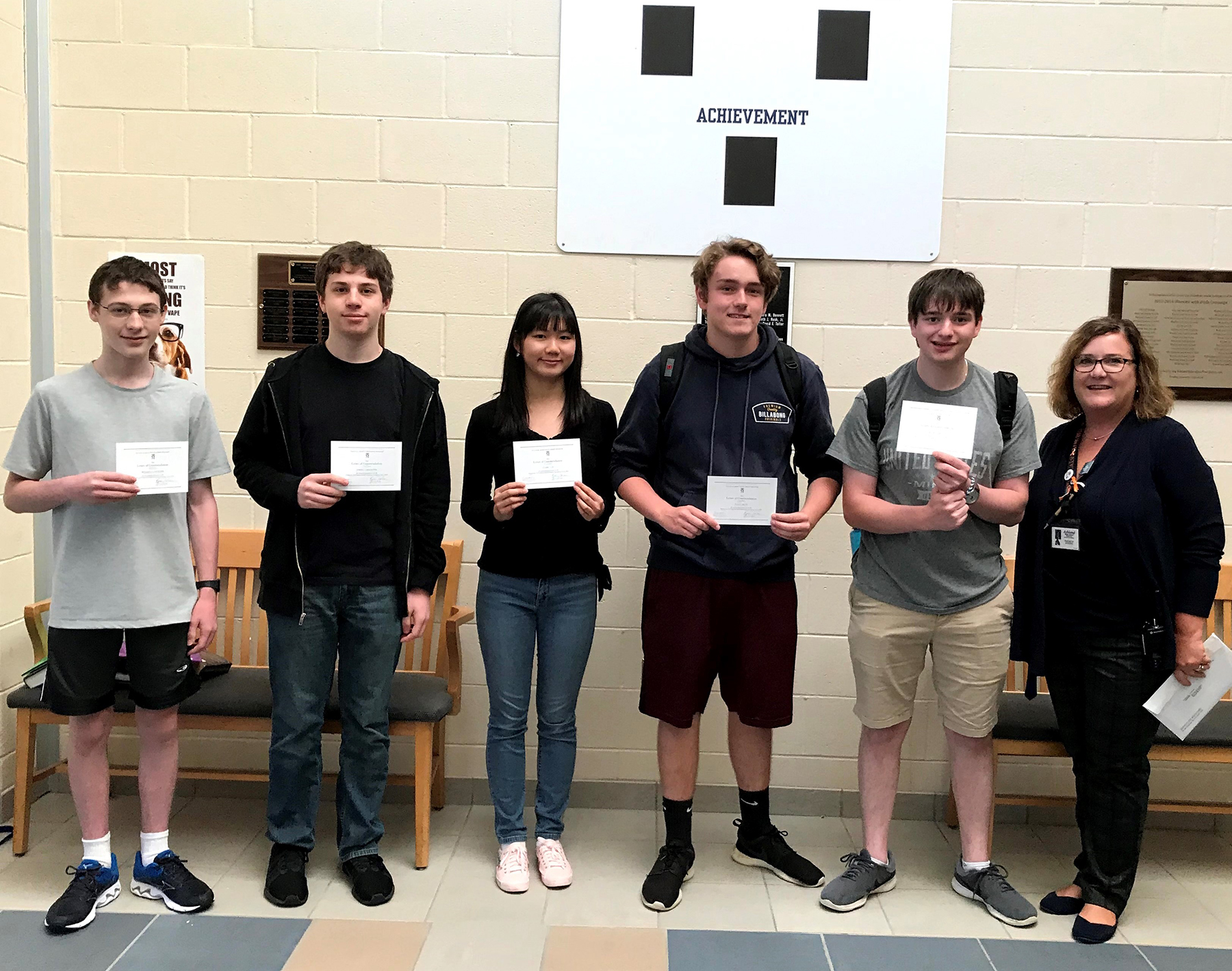 (Left to right) Benjamin Esenther, Aaron Greenstein, Claire Liu, John Kelly, Eli Prybyla and Principal Kelley St. Coeur. (Photo/supplied)