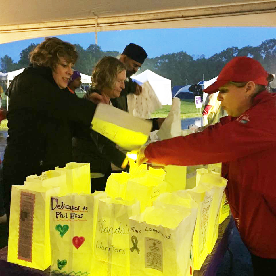 Teresa Fernald manning the Luminaria table at last year’s Relay for Life. This year, The Relay for Life of Western Norfolk County has combined two Relay for Life Events into one. The event will take place starting June 15th, at 6 p.m., until 6 a.m. the next day.