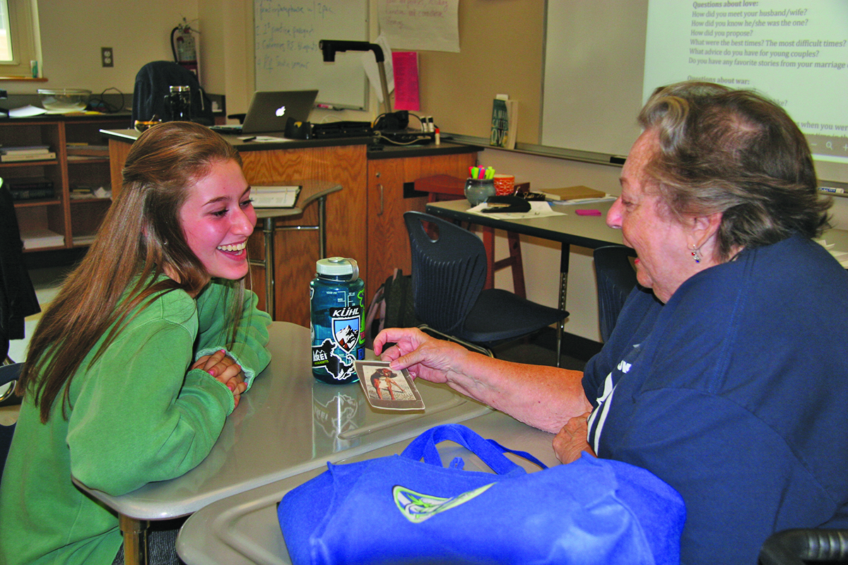 A Seeker sharing a photo with her Sage. (Photo/Elly Katz)