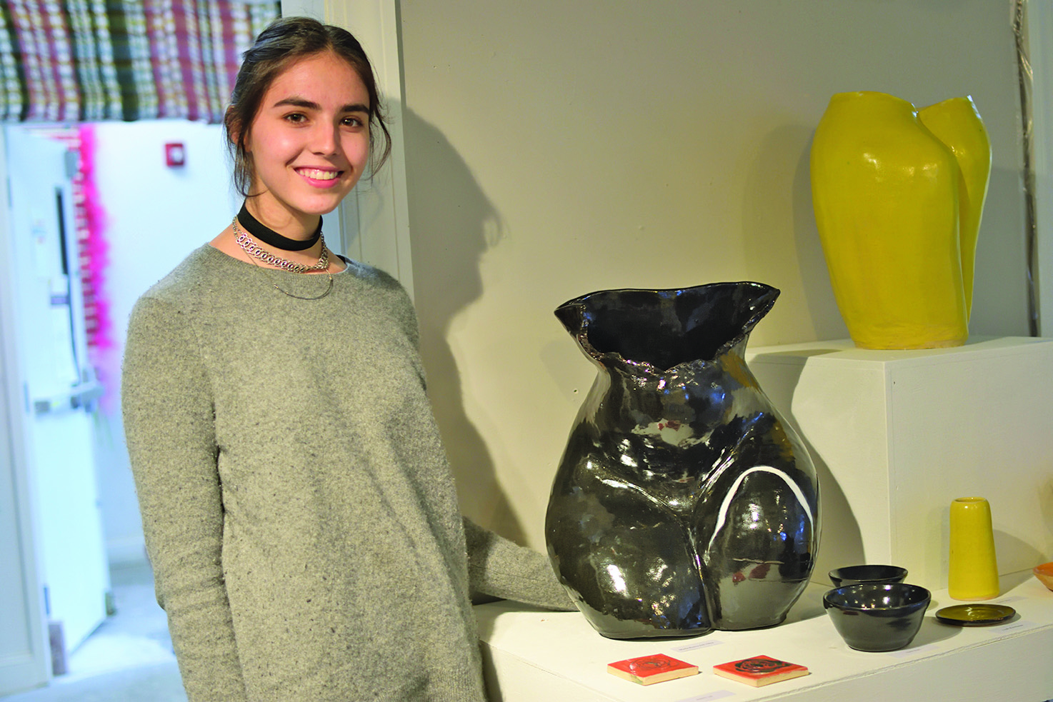 Maria Ilbarra del Villar standing next to her sculpted figure. (Photo/Via Perkins)